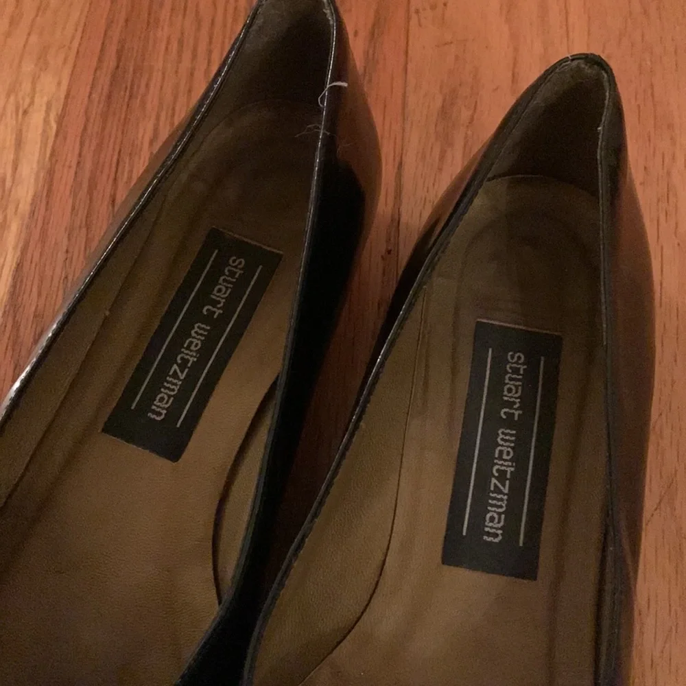 Stuart Weitzman black patent leather loafers with gold plaques and low heel 6